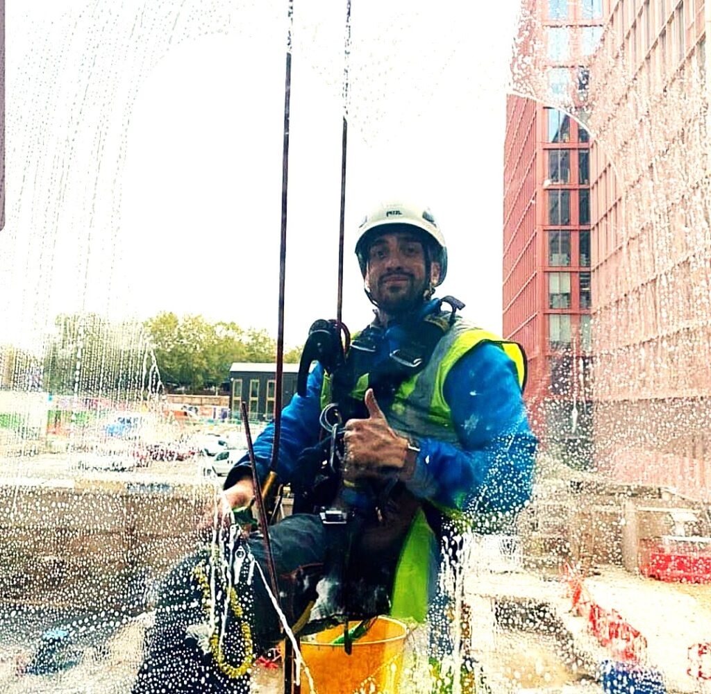 High altitude worker on service cleaning windows